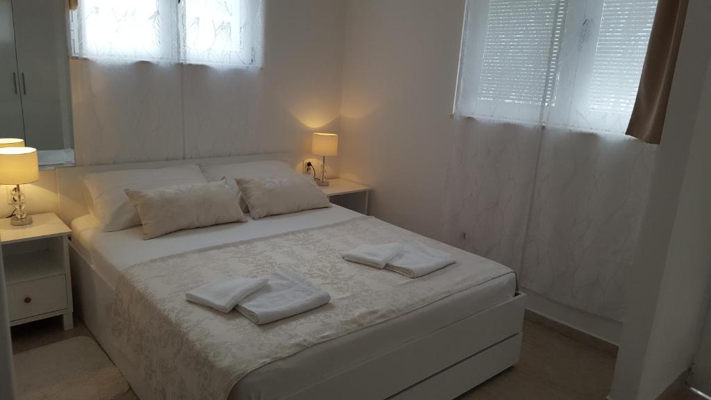 Postel nebo postele na pokoji v ubytování Rooms Valentino