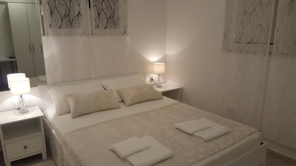 Postel nebo postele na pokoji v ubytování Rooms Valentino