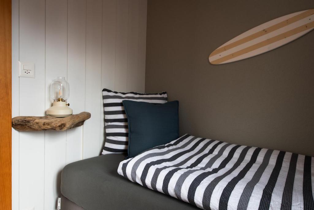 Letto o letti in una camera di Beachhouse 16 Brienzersee