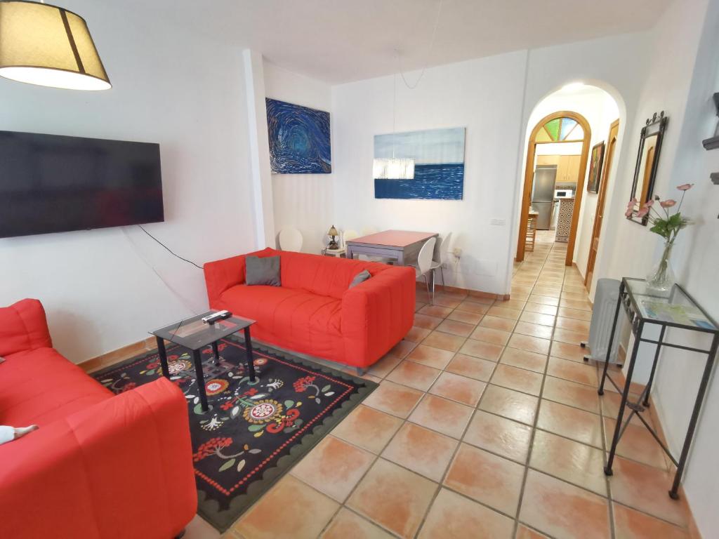 Televízia a/alebo spoločenská miestnosť v ubytovaní Casa Familia Carabeo