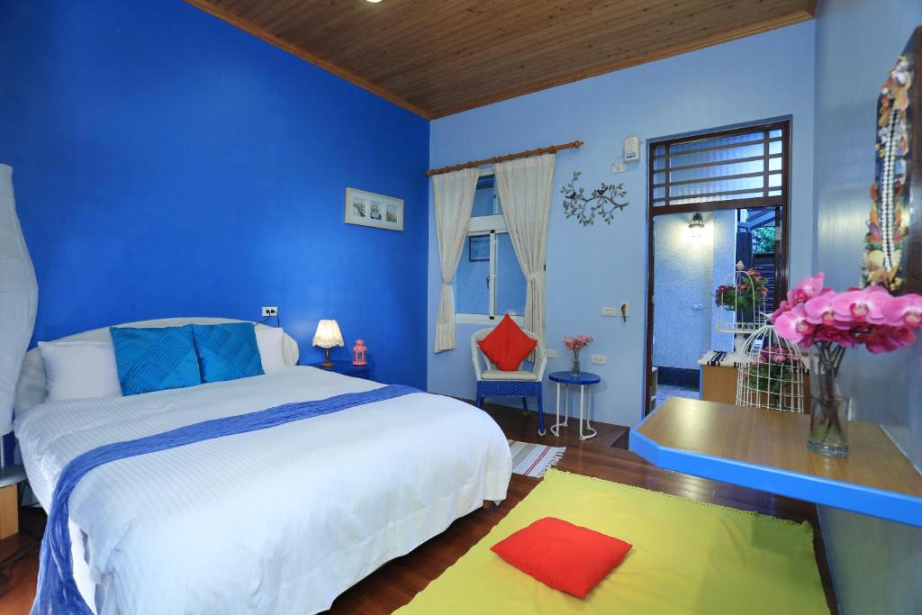 Postel nebo postele na pokoji v ubytování Zhen Shan Zhuang B&B