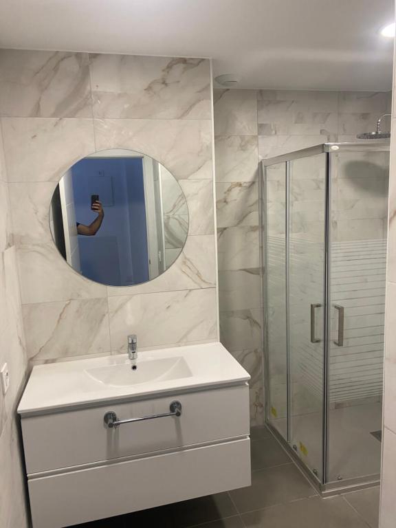 a bathroom with a sink and a shower at Lucy lux apartament in Las Palmas de Gran Canaria