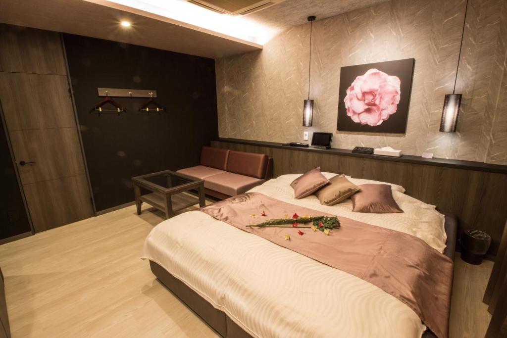 Postel nebo postele na pokoji v ubytování ホテル アンジュエトワール 堺 - Adult Only