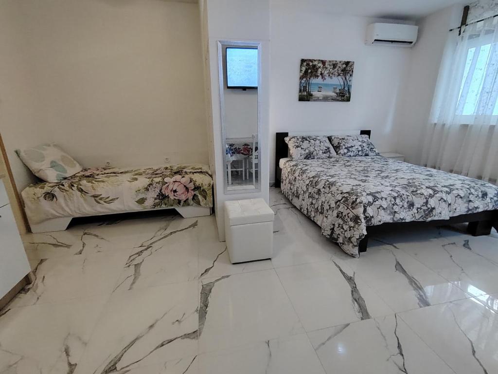 Posteľ alebo postele v izbe v ubytovaní Studio-apartman Ella