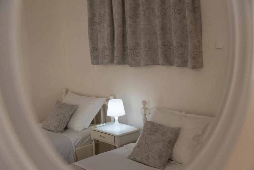 Ένα ή περισσότερα κρεβάτια σε δωμάτιο στο Evillion