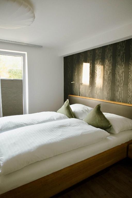 Postel nebo postele na pokoji v ubytování Feelfalt Hotel