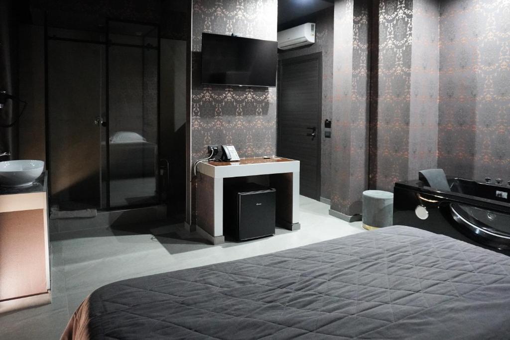 Postel nebo postele na pokoji v ubytování Hotel El Pamas