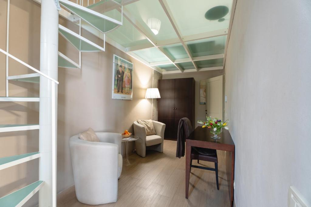A seating area at Borgo Suite Apartment