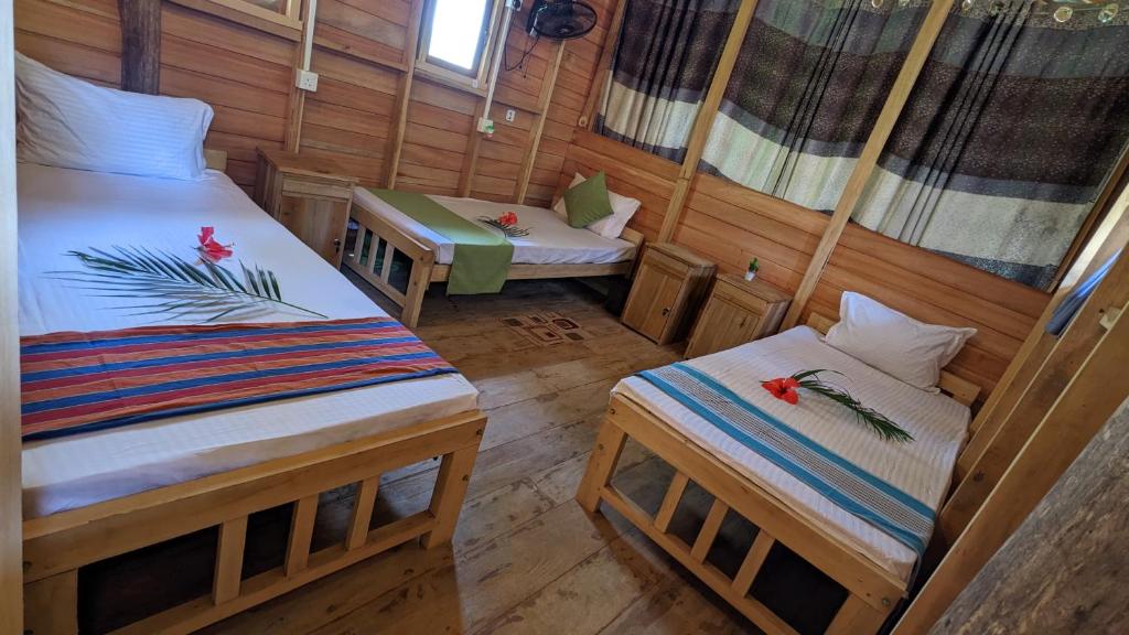 Postel nebo postele na pokoji v ubytování Ocean bliss hiriketiya