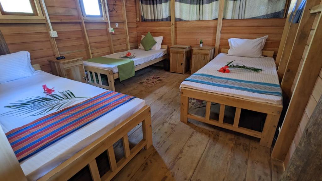Postel nebo postele na pokoji v ubytování Ocean bliss hiriketiya