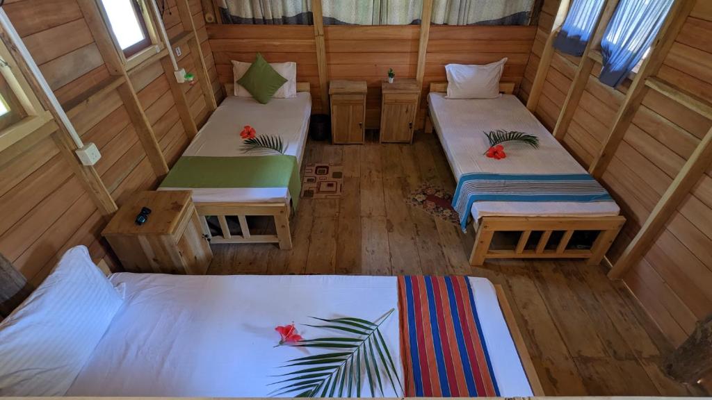 Postel nebo postele na pokoji v ubytování Ocean bliss hiriketiya