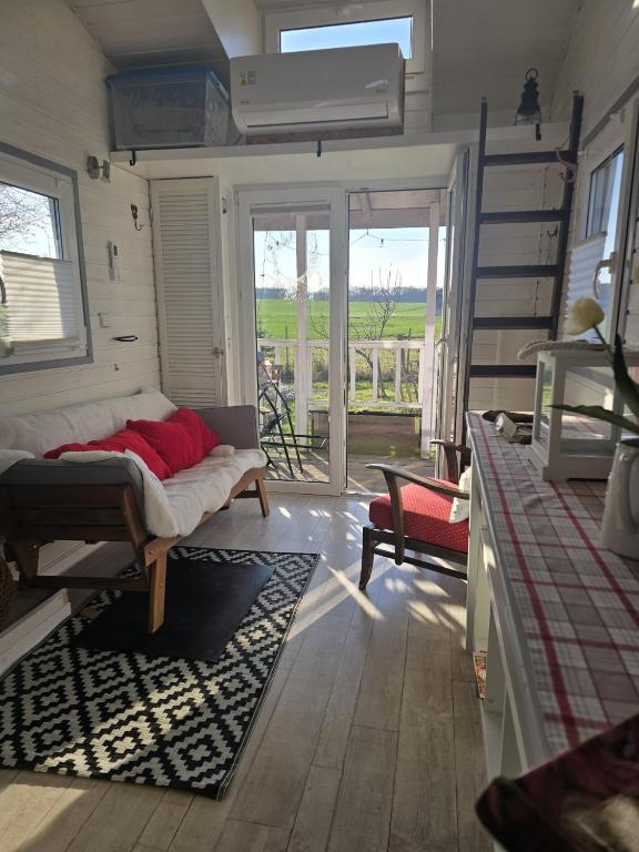 Postel nebo postele na pokoji v ubytování Tiny House