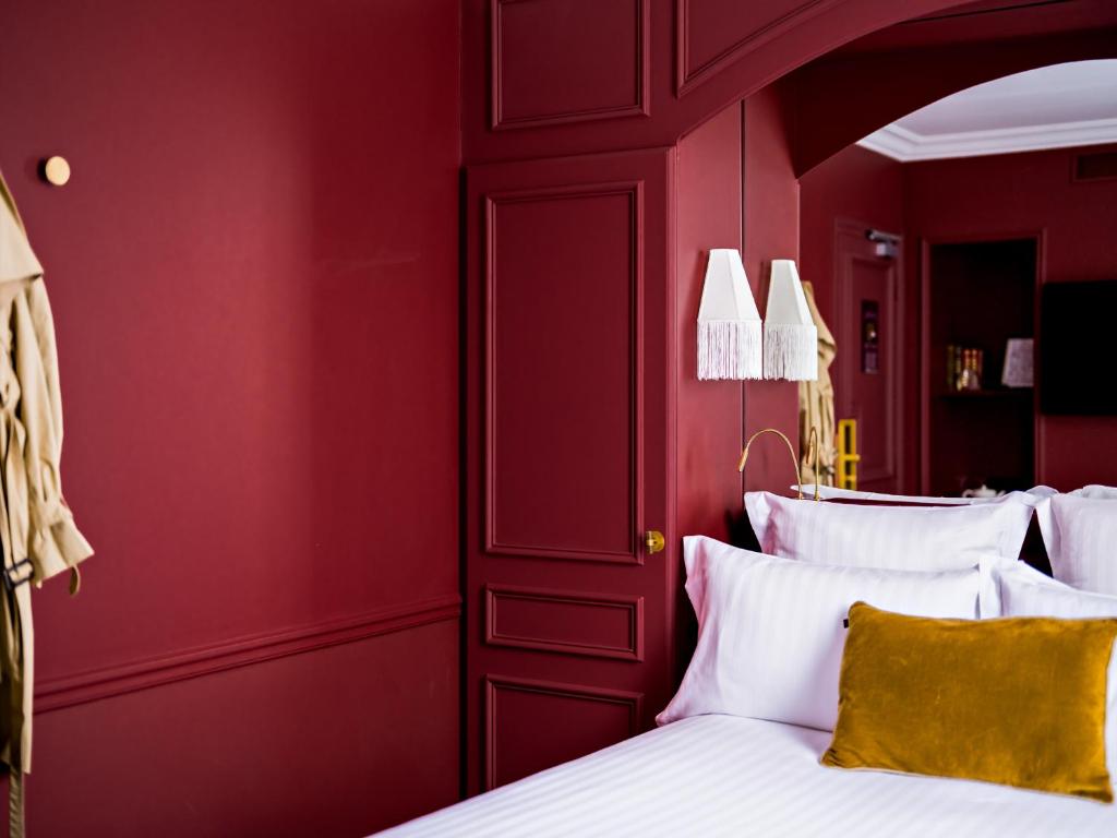 Postel nebo postele na pokoji v ubytování Hotel Duquesne Eiffel
