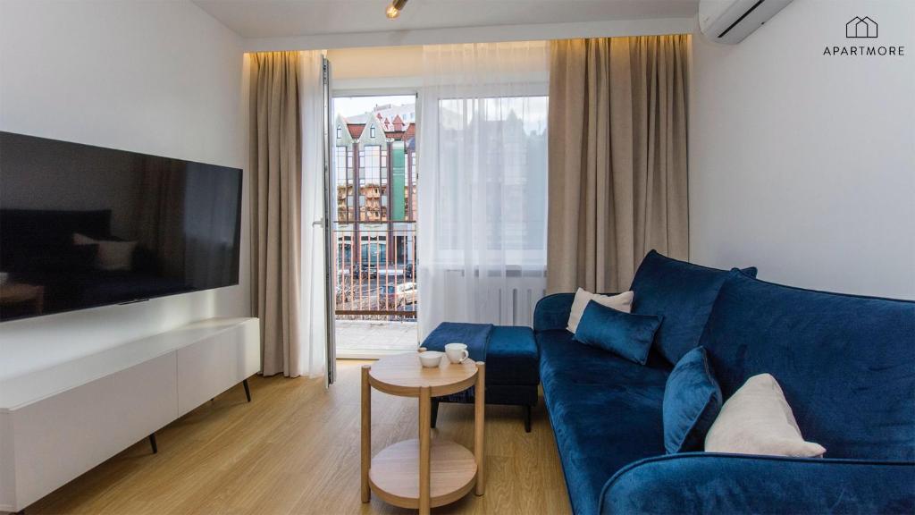 TV a/nebo společenská místnost v ubytování City Break Apartments by Apartmore