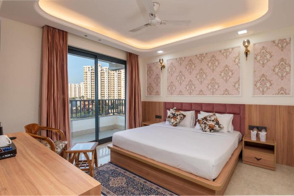 Postel nebo postele na pokoji v ubytování Aatithyam Residency-Golf Course Road Gurgaon