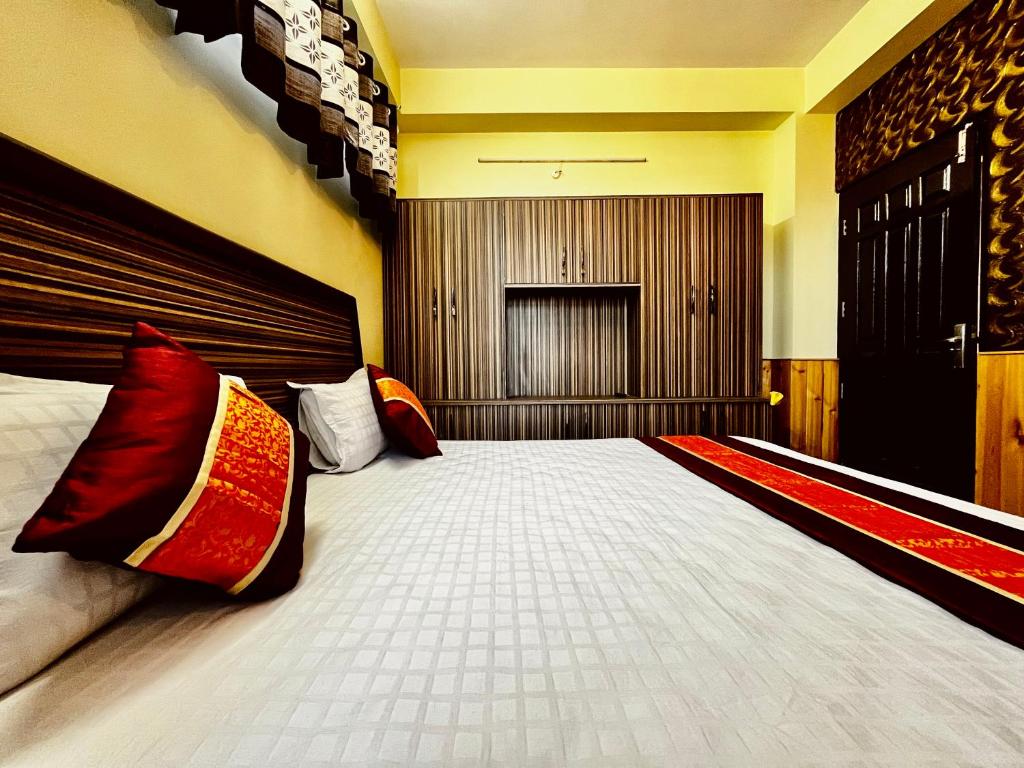 Postel nebo postele na pokoji v ubytování Puri's BnB