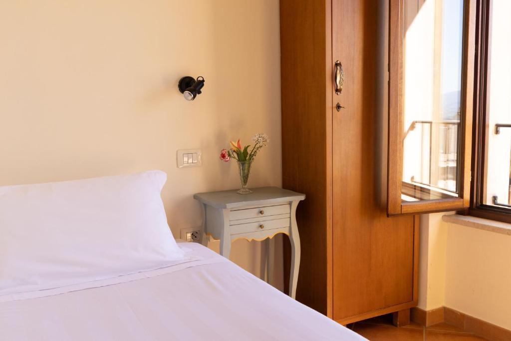Postel nebo postele na pokoji v ubytování Hotel Monastero Sant'Andrea