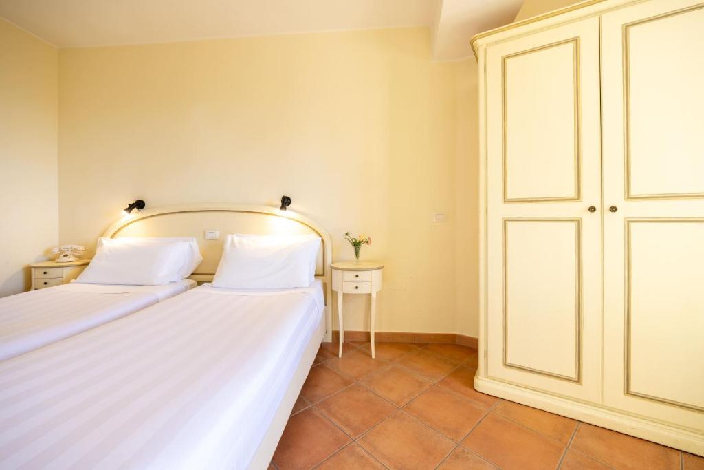 Postel nebo postele na pokoji v ubytování Hotel Monastero Sant'Andrea