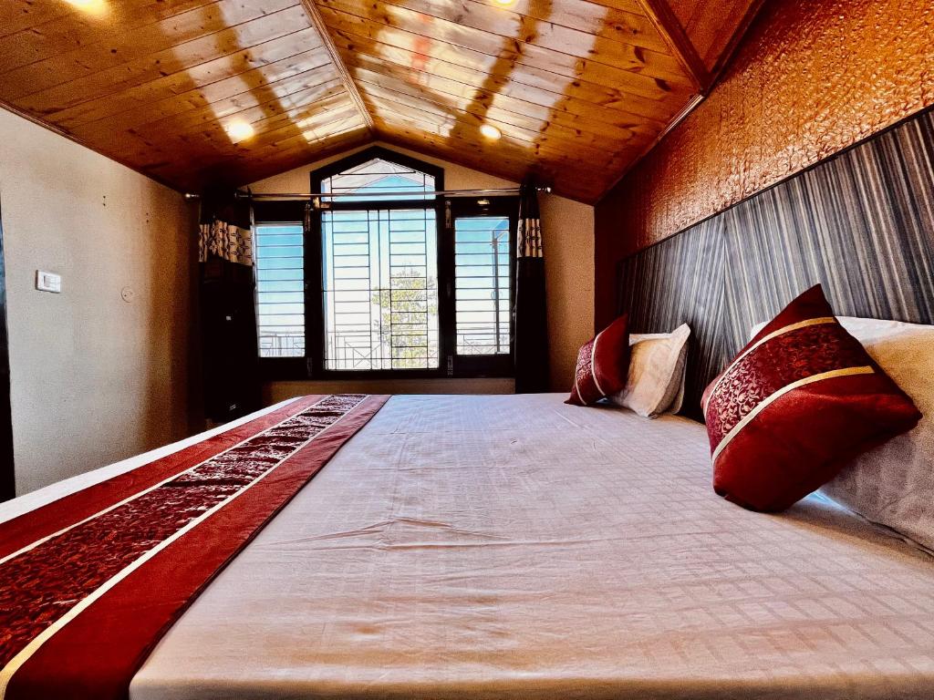 Postel nebo postele na pokoji v ubytování Puri's BnB
