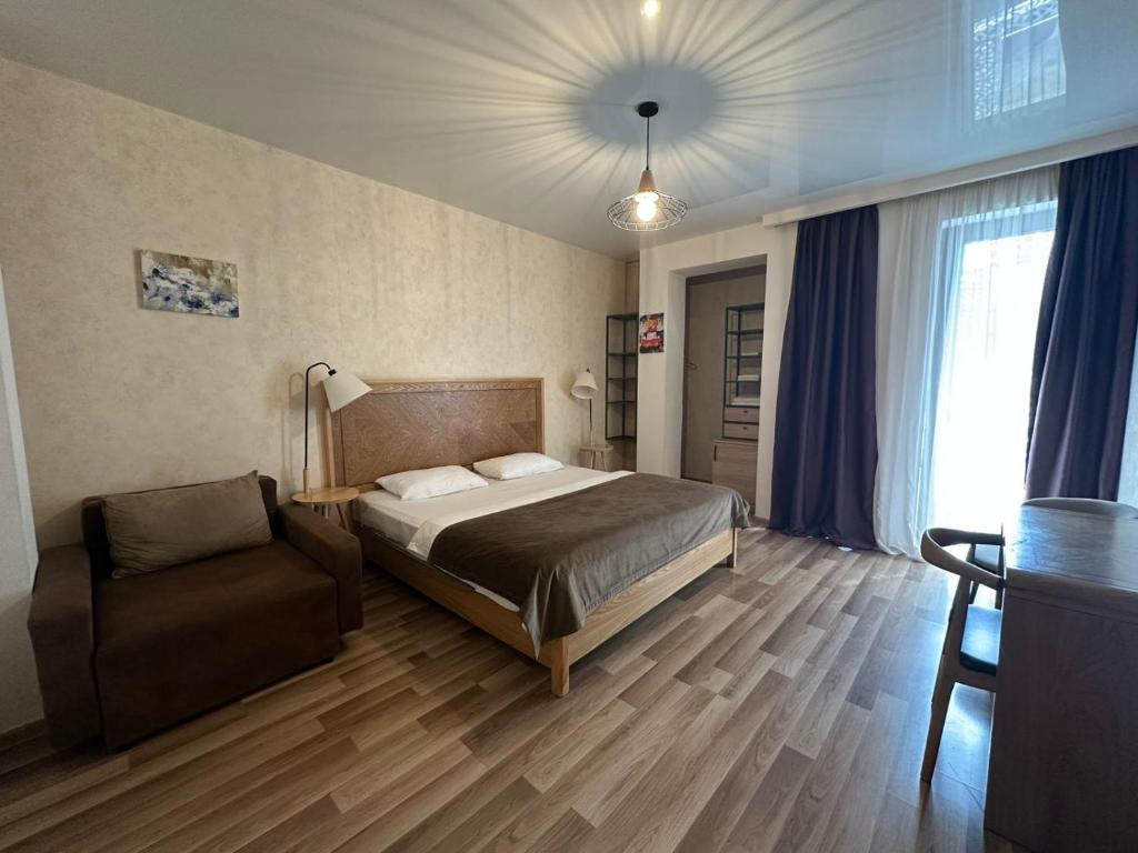 Postel nebo postele na pokoji v ubytování Hotel cozy jano