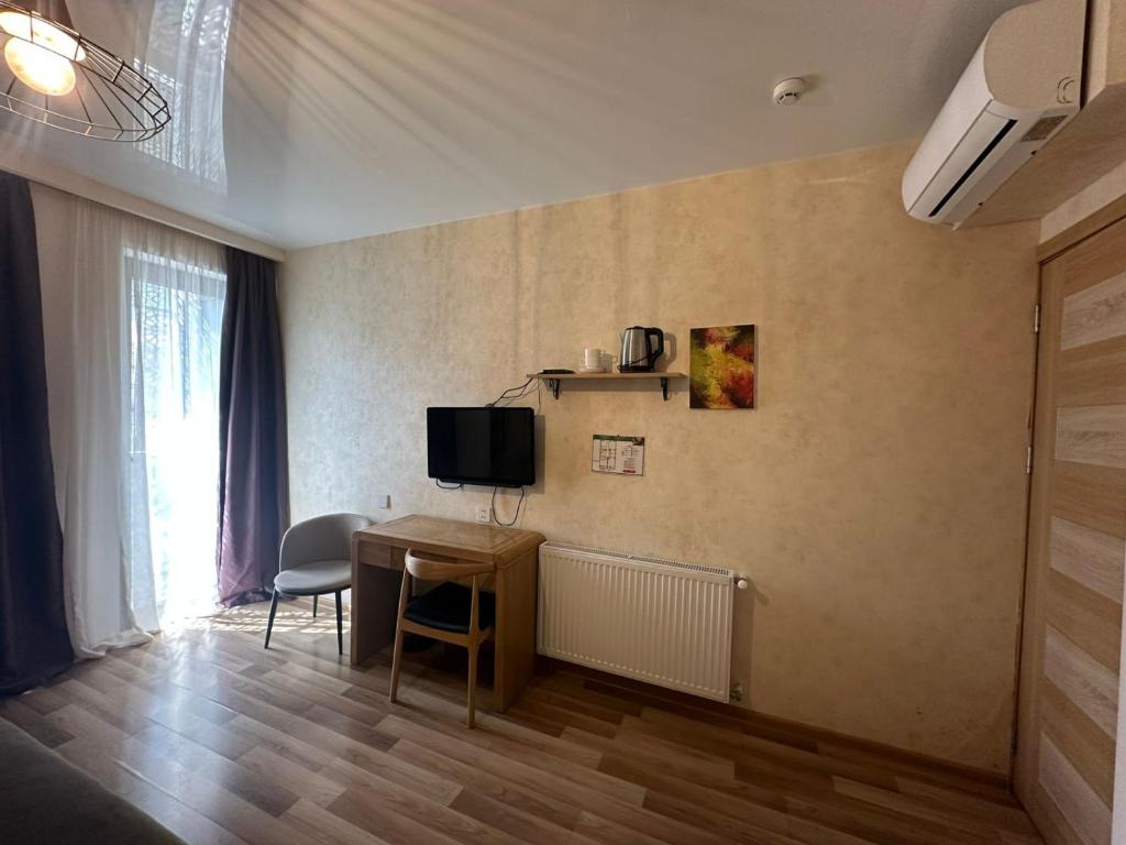 TV a/nebo společenská místnost v ubytování Hotel cozy jano