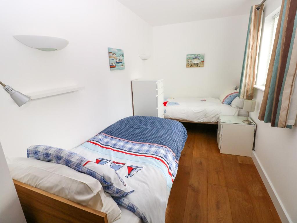 a room with two twin beds in it at Gwelfor, Marloes in Haverfordwest