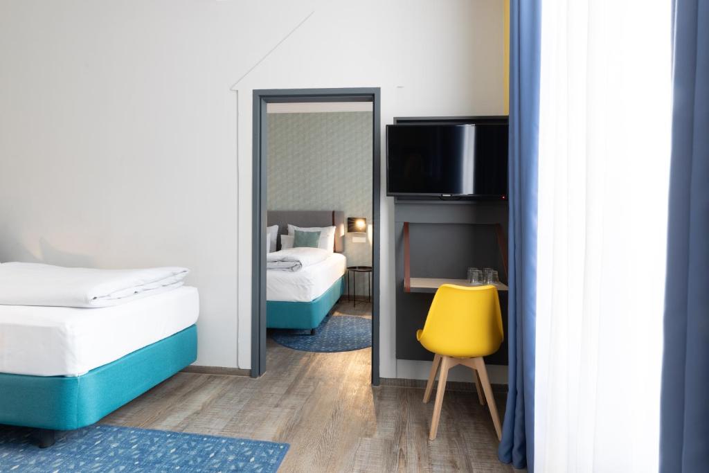 Postel nebo postele na pokoji v ubytování Garner Hotel Vienna by IHG