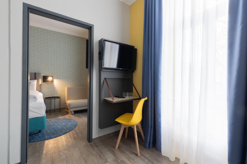 Postel nebo postele na pokoji v ubytování Garner Hotel Vienna by IHG