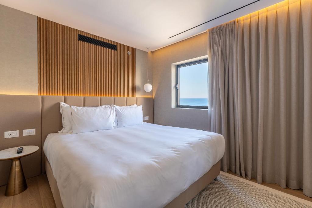 Postel nebo postele na pokoji v ubytování Seanergy Boutique & Spa Hotel