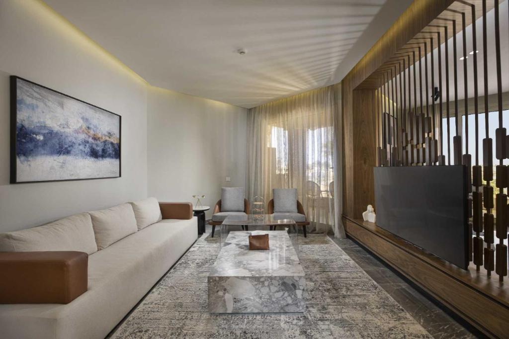 a living room with a couch and a table at V Hotel Sharm El Shiekh in Sharm El Sheikh