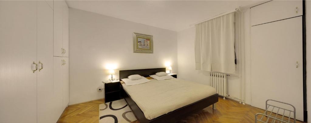 Postel nebo postele na pokoji v ubytování Apartman Osijek