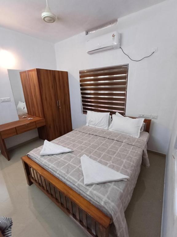 Postel nebo postele na pokoji v ubytování East West Beach Resorts