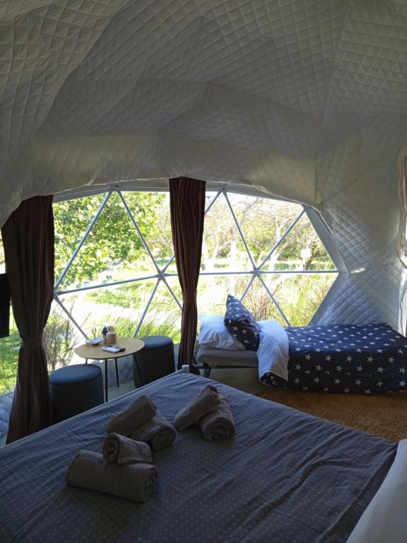 Postel nebo postele na pokoji v ubytování Lemon Tree Dome House