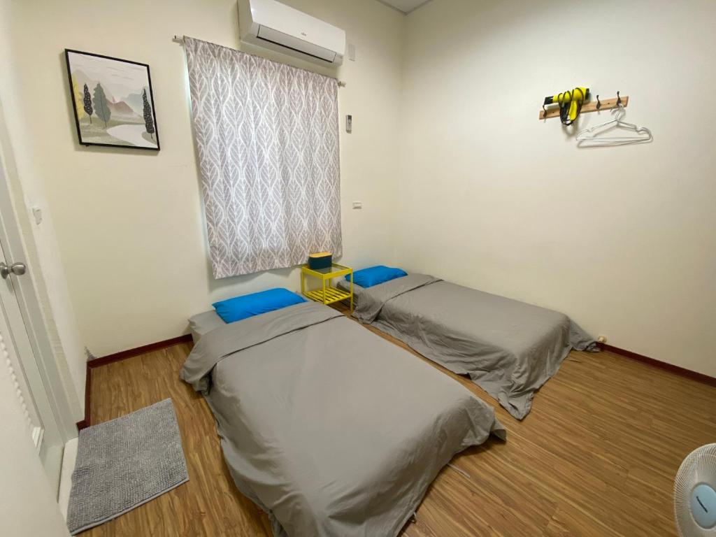 Postel nebo postele na pokoji v ubytování Chill島嶼
