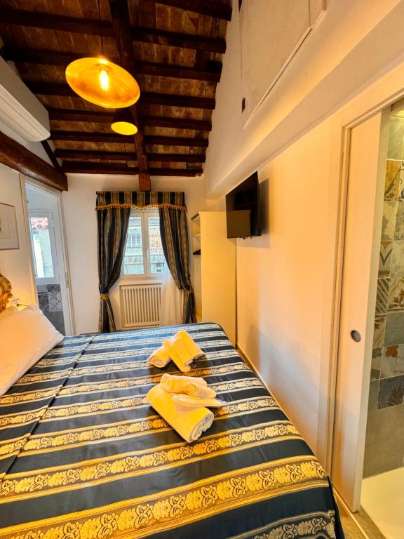 Postel nebo postele na pokoji v ubytování Piccolo Paradiso