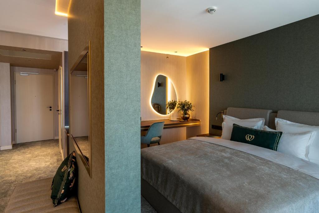 Postel nebo postele na pokoji v ubytování Le Primore Hotel & Spa
