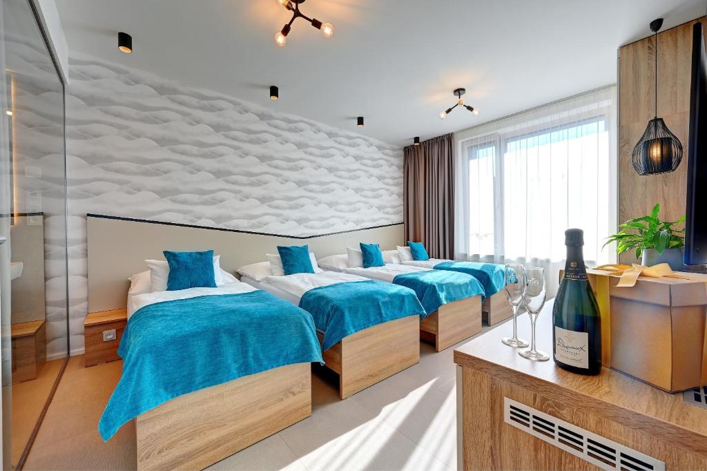 Postel nebo postele na pokoji v ubytování Wellness Hotel Fénix