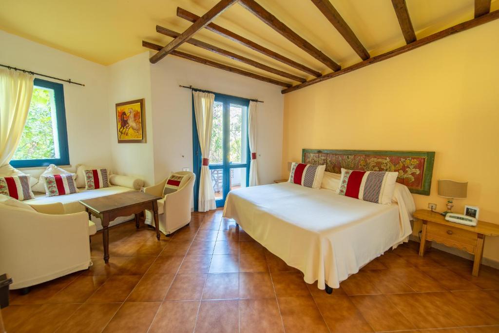 Postel nebo postele na pokoji v ubytování Su Gologone Experience Hotel