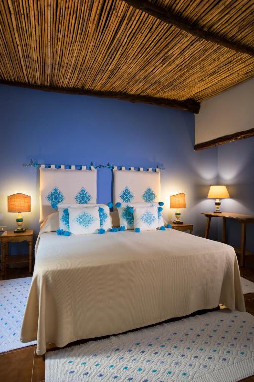 Postel nebo postele na pokoji v ubytování Su Gologone Experience Hotel