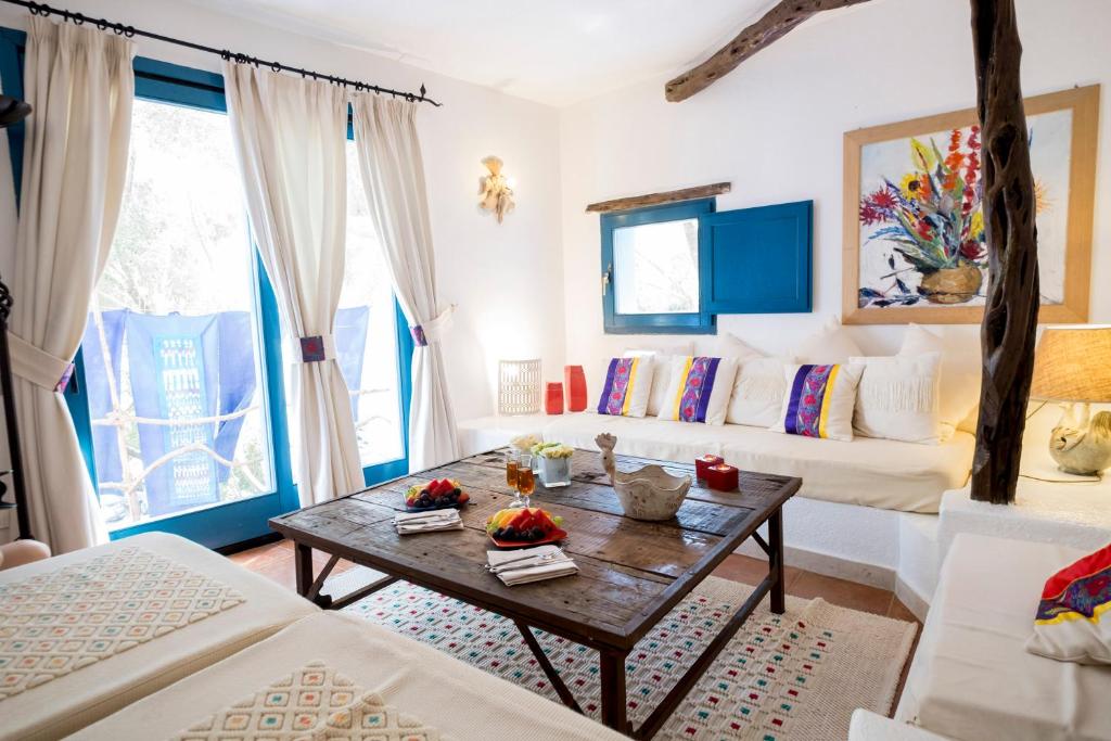 Postel nebo postele na pokoji v ubytování Su Gologone Experience Hotel