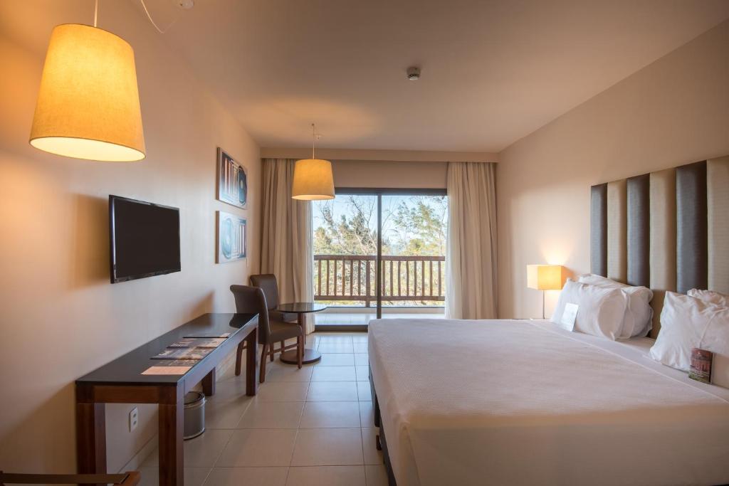 Postel nebo postele na pokoji v ubytování Vila Galé Resort Cumbuco - All inclusive