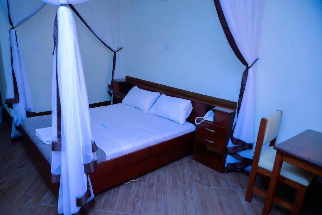 Postel nebo postele na pokoji v ubytování Hotel Acacia View