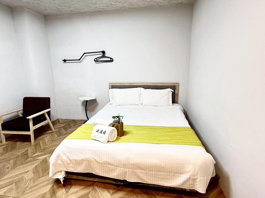 Postel nebo postele na pokoji v ubytování 希沐溫泉行旅