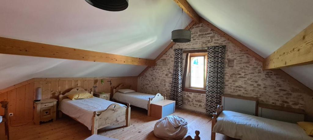 Postel nebo postele na pokoji v ubytování Gîte l'érable