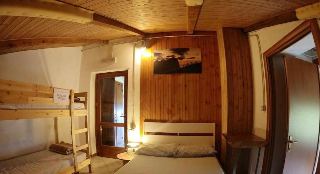Postel nebo postele na pokoji v ubytování Rifugio Fontana Mura