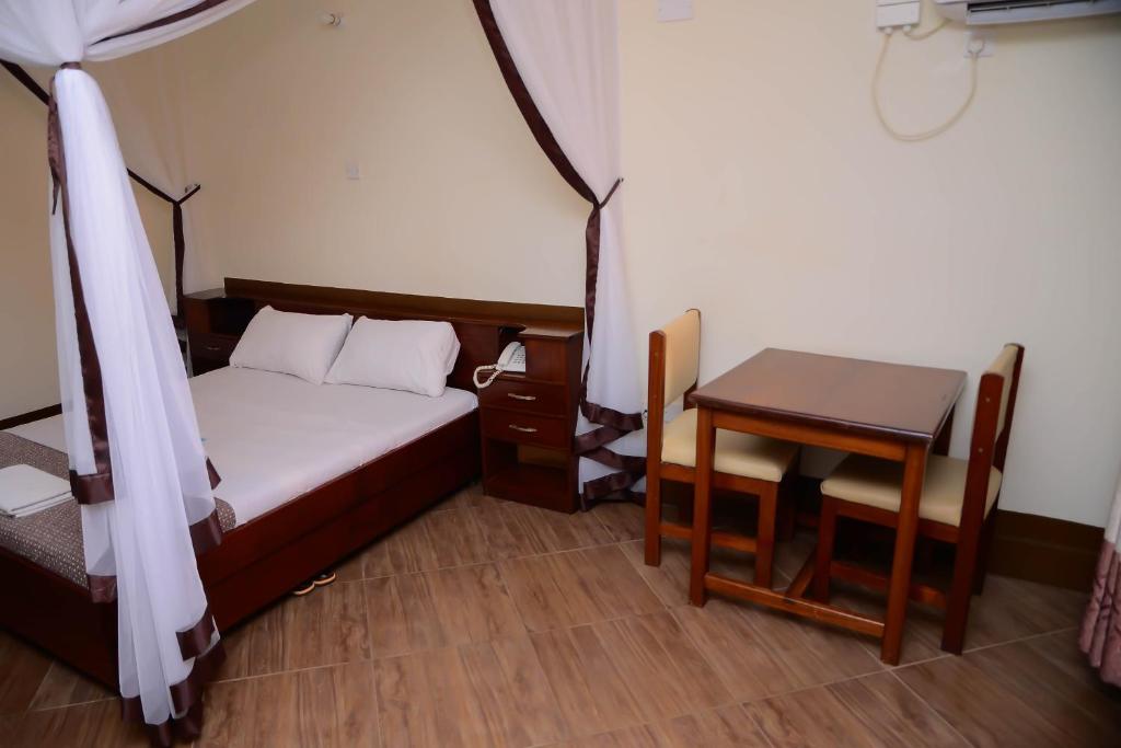 Postel nebo postele na pokoji v ubytování Hotel Acacia View
