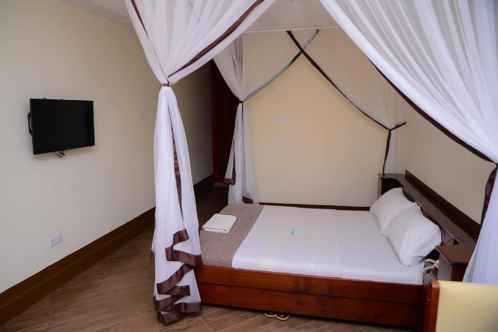 Postel nebo postele na pokoji v ubytování Hotel Acacia View