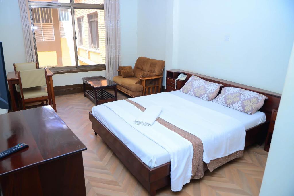 Postel nebo postele na pokoji v ubytování Hotel Acacia View