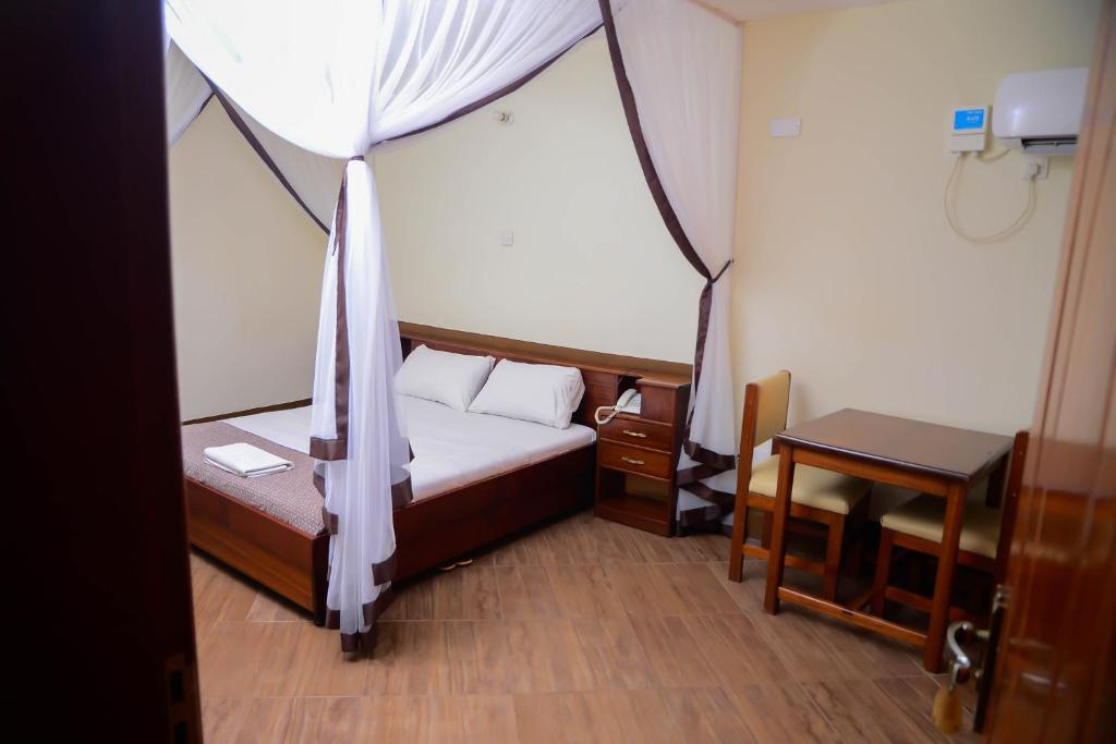 Postel nebo postele na pokoji v ubytování Hotel Acacia View