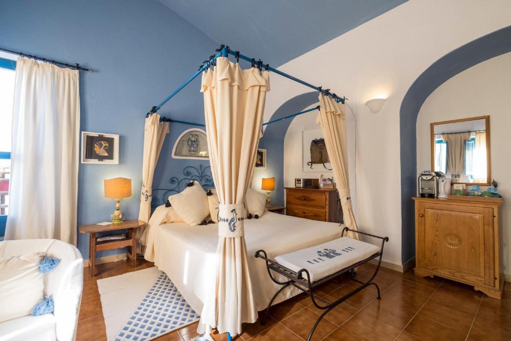 Postel nebo postele na pokoji v ubytování Su Gologone Experience Hotel